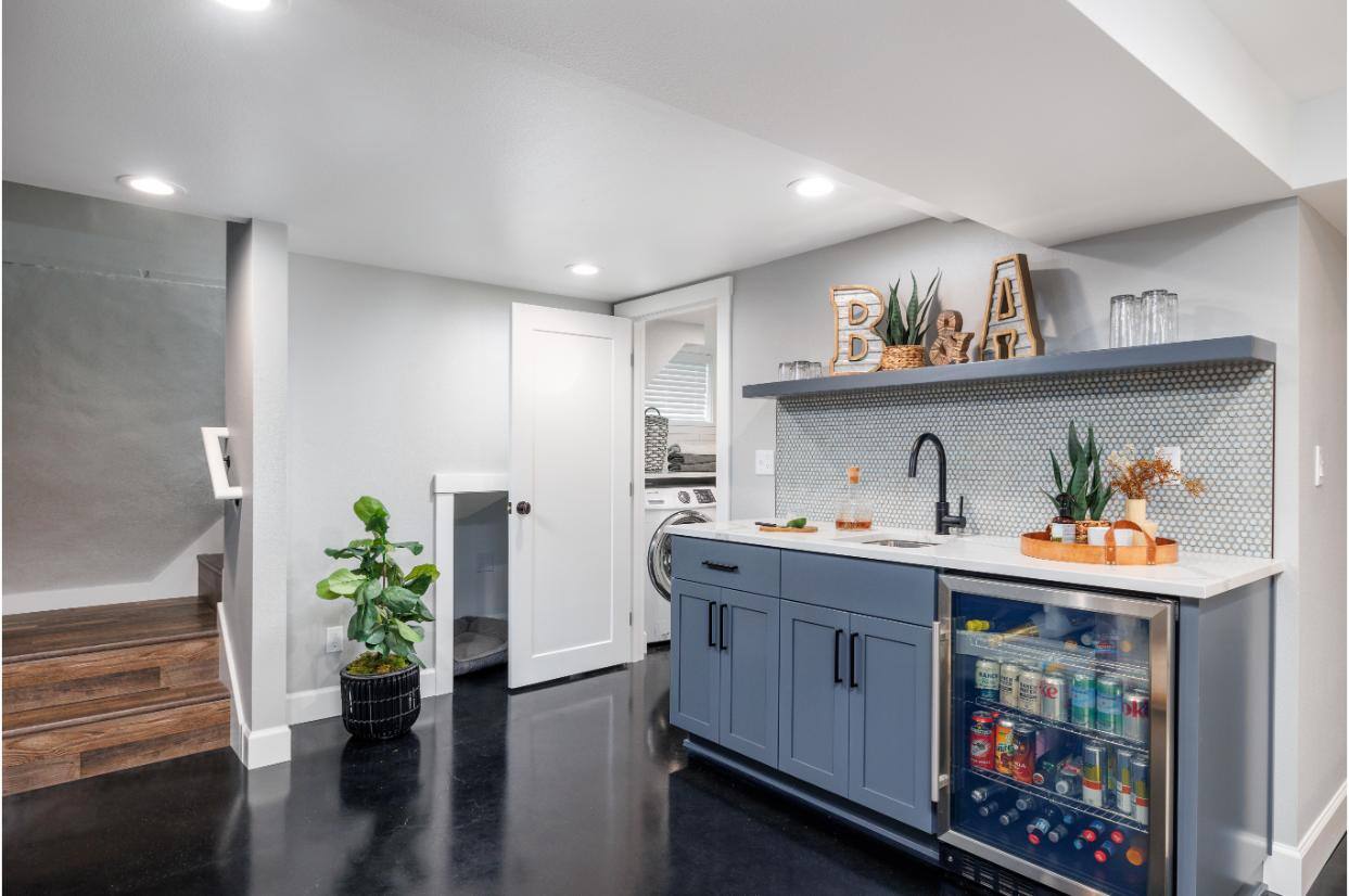 Remodeled Basement Kitchen Area and Laundry Room by Creekstone Design + Remodel