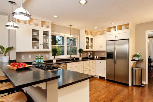 Traditional kitchen with white cabinets and hardwood floors