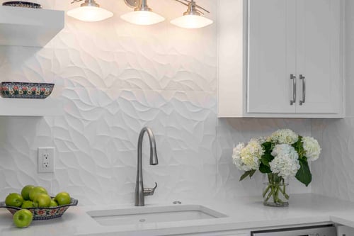 Remodeled kitchen with classy white backsplash by Creekstone Design + Remodel in Portland, OR