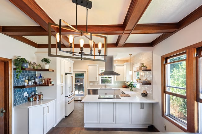 Remodeled Kitchen with Exposed Beams and Tile Backsplash by Creekstone Design + Remodel in Portland, OR