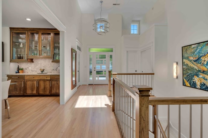 Remodeled entry-way of home with bar area by Creekstone Design + Remodel in Portland, OR