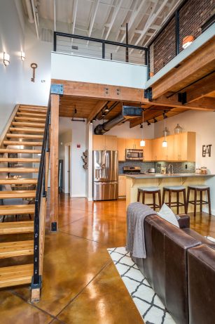 Industrial-Kitchen-with-Built-in-Cabinets-Concreet-Floors-Exposed-Wood-Beams-Pendant-Lights-Black-Track-Lights-Grey-Countertops-Island-Seating-Mosaic--Jan-18-2022-05-43-22-96-PM