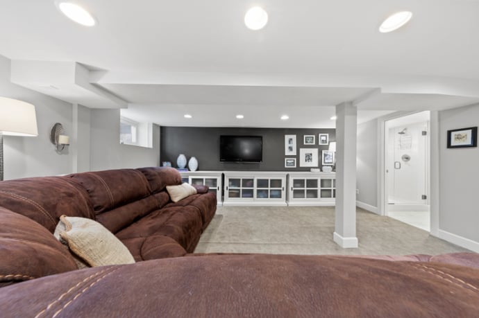 Remodeled Basement in Portland, OR with Large Entertainment Space by Creekstone Design + Remodel