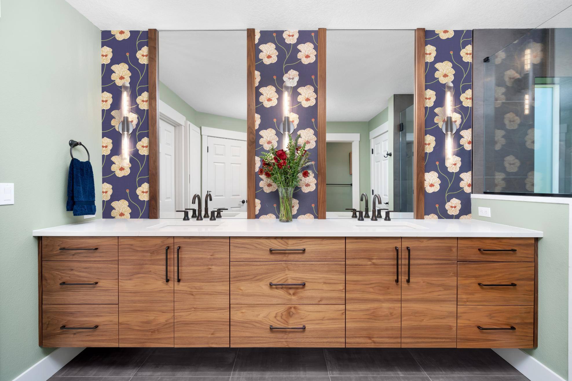 Remodeled bathroom vanity with jack and jill sinks and floral wallpaper in Forest Grove, OR by Creekstone Design + Remodel