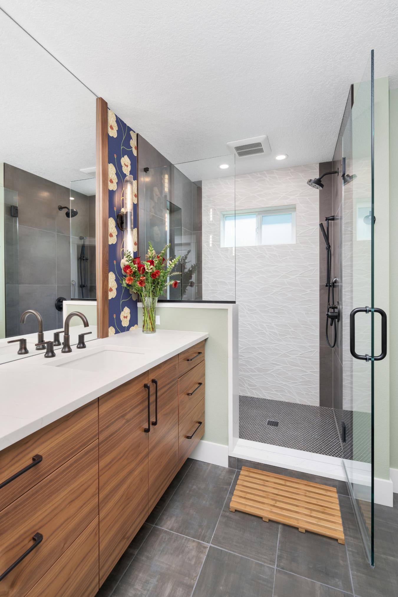 Remodeled bathroom view of vanity and walk-in shower in Forest Grove, OR by Creekstone Design + Remodel