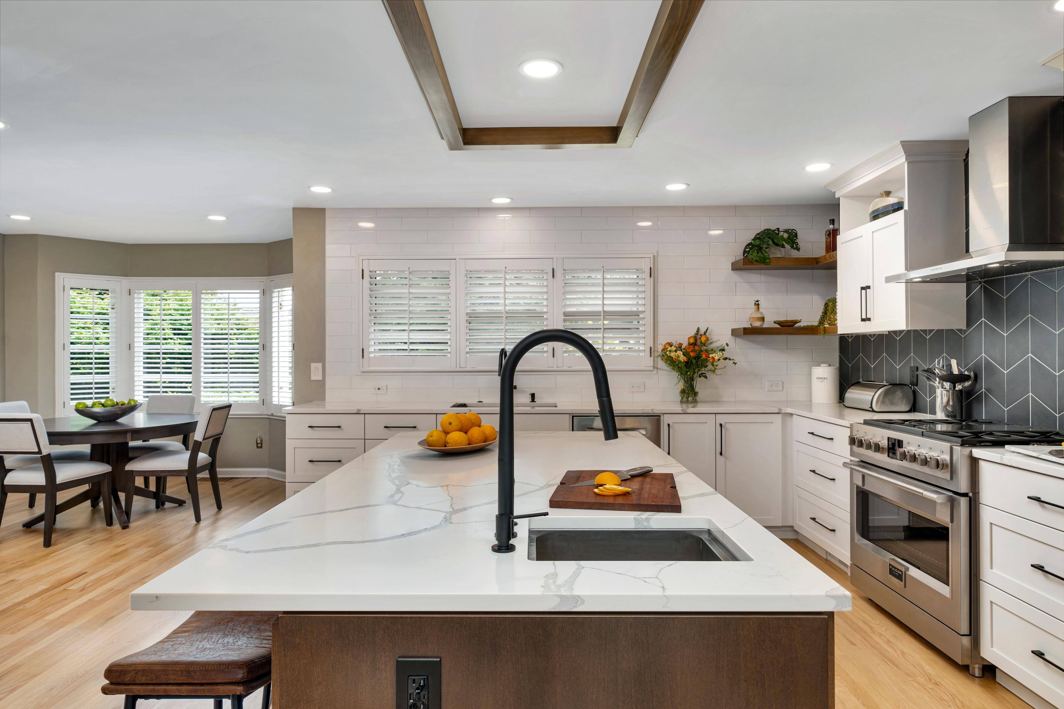 Southwest Hills Kitchen view from island area featuring dining table and full kitchen by Creekstone Design + Remodel