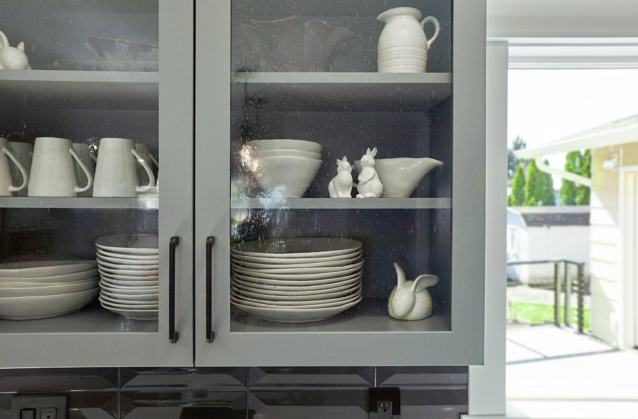 Remodeled kitchen with frameless gray cabinetry in Tigard, OR by Creekstone Design + Remodel