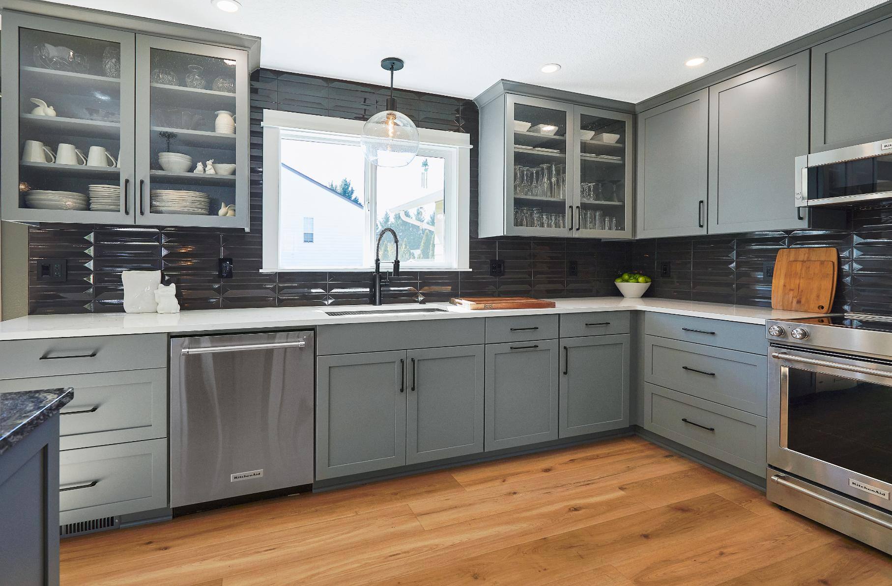 Remodeled kitchen with gray cabinetry in Tigard, OR by Creekstone Design + Remodel