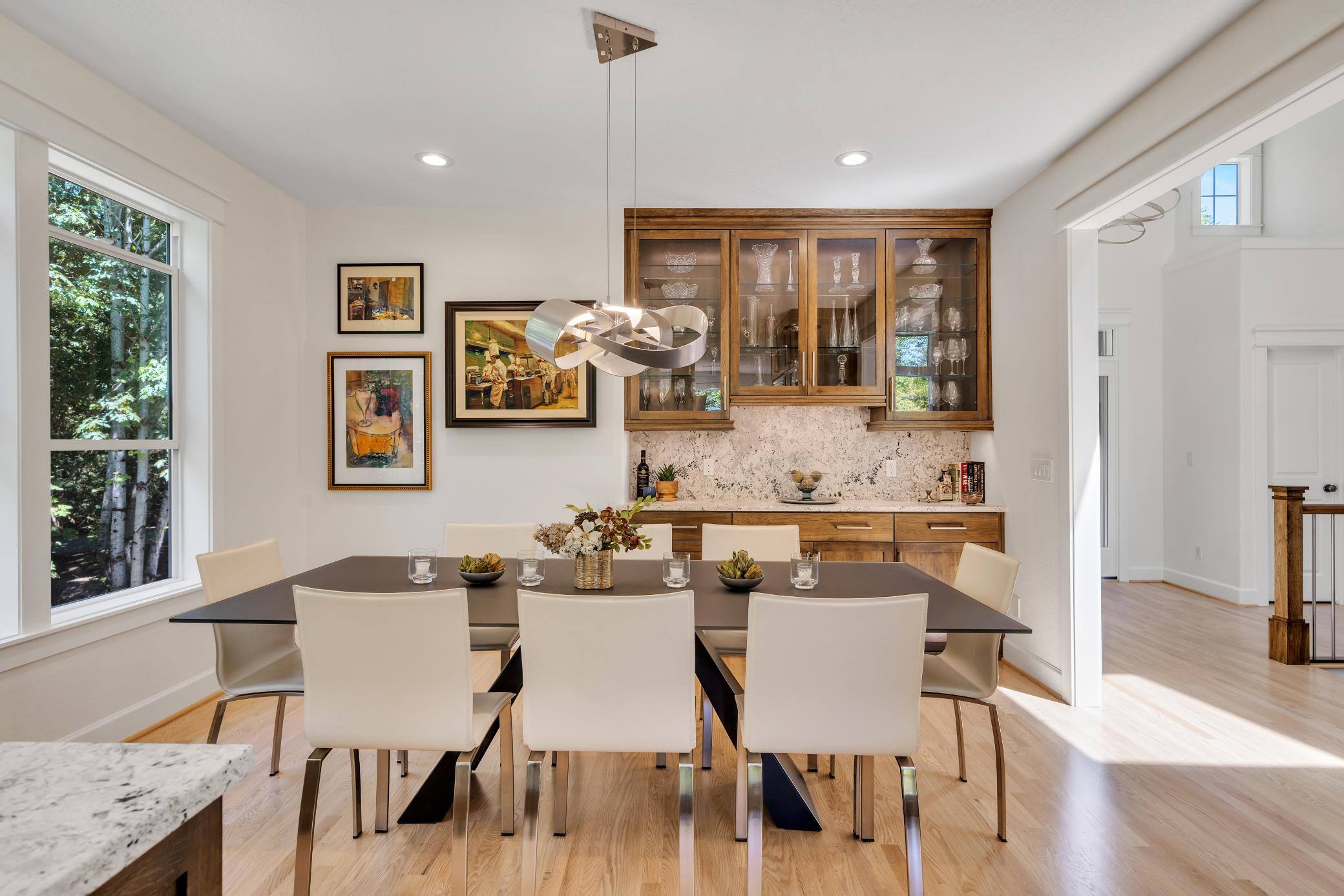 West-Sylvan Kitchen Remodel dining table and bar area by Creekstone Design + Remdole