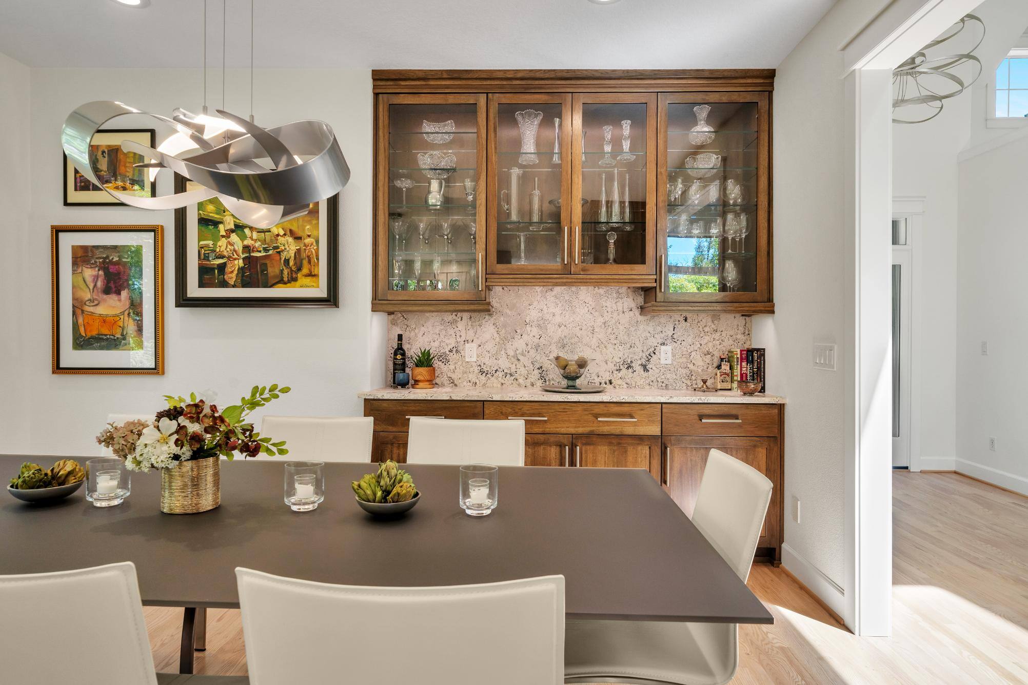 West-Sylvan Kitchen Remodel dining table and bar area by Creekstone Design + Remodel